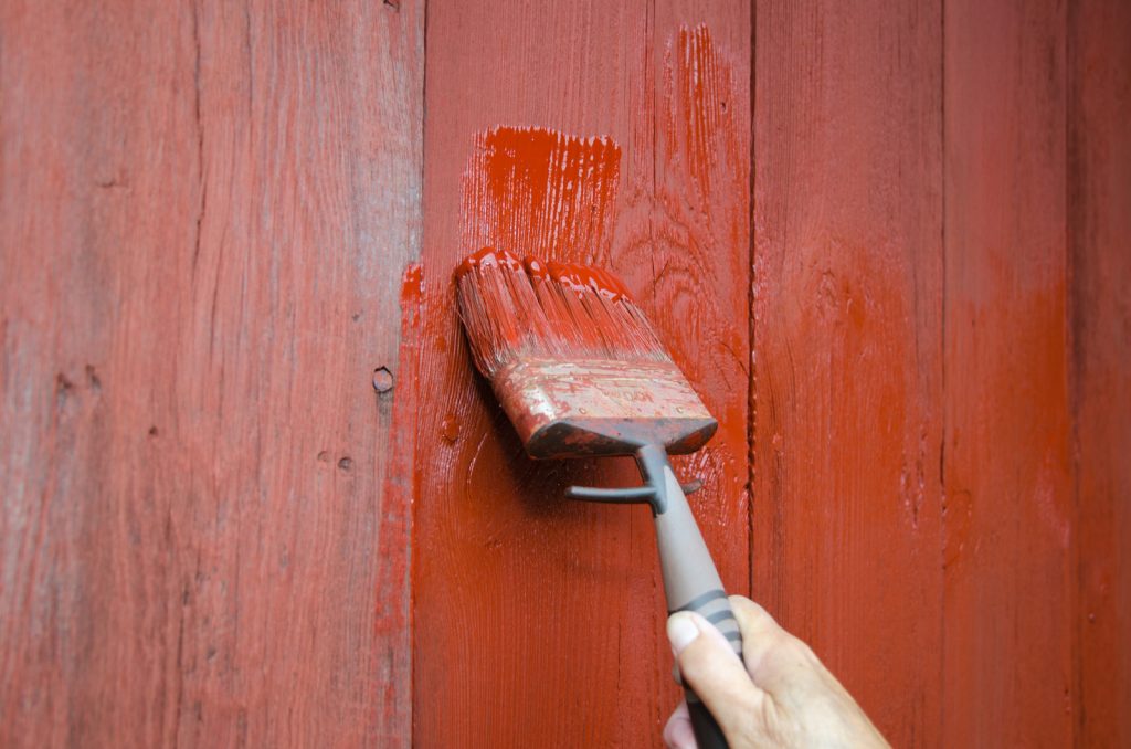 painting the exterior of a house home maintenance task