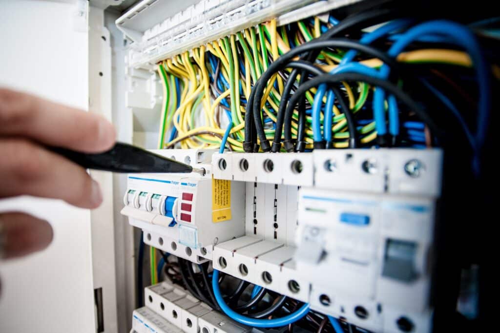 electrician checking a power board