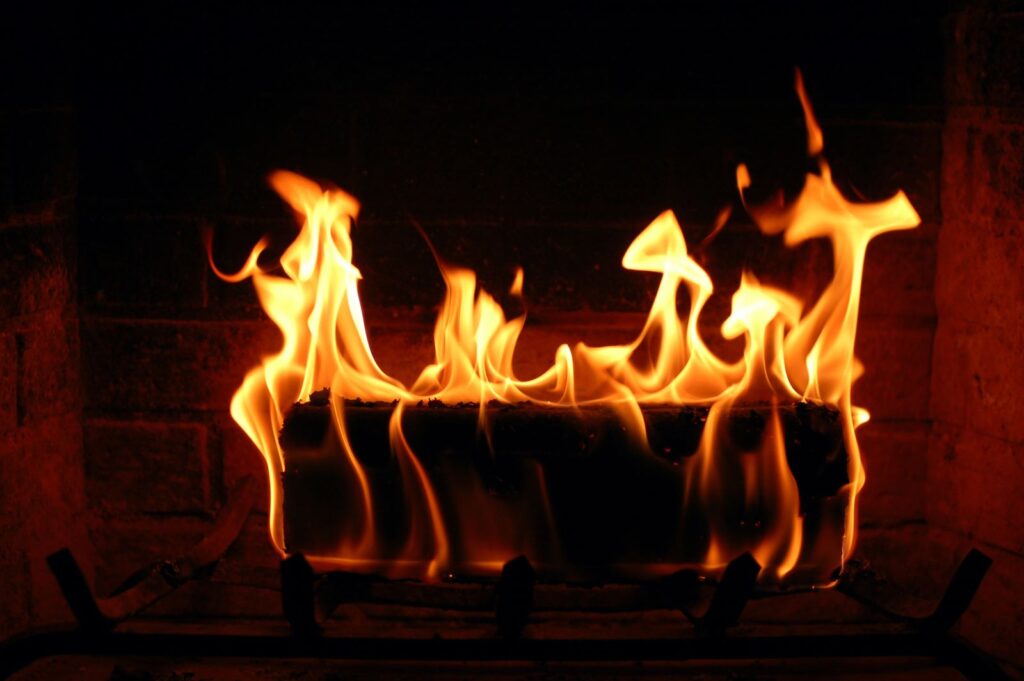 wood being burnt in modern woodburners 