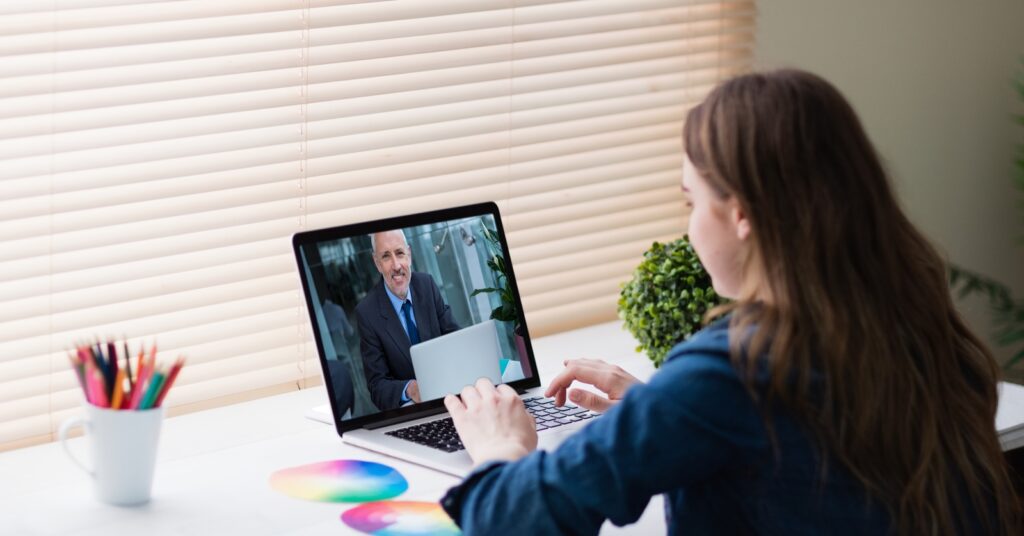 person using laptop in office setting