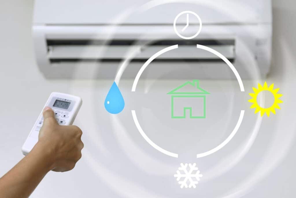 air conditioner cycle with person holding remote