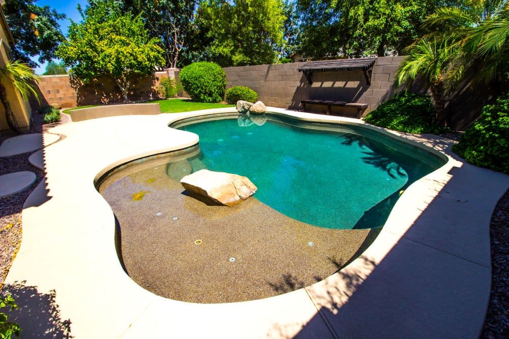 refurbished concrete pool with rocks