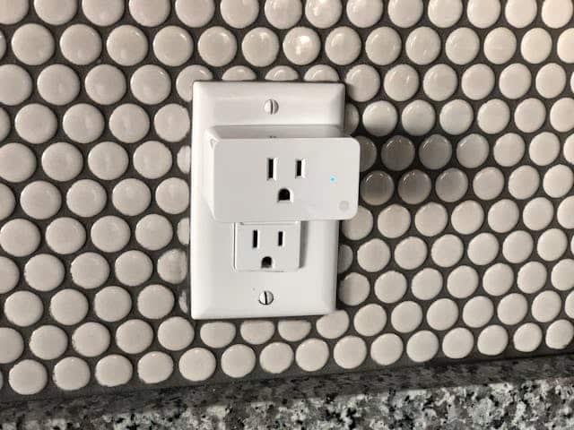 A smart power plug in an electrical outlet.