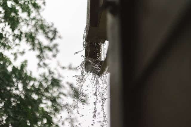 rain overflow from a roofing gutter